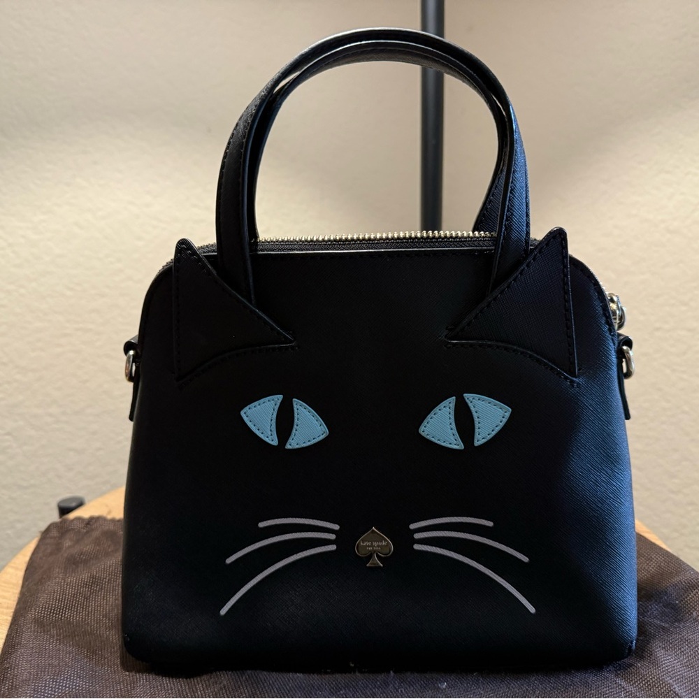 kate spade Black Satchel with Light Blue Eye Accents